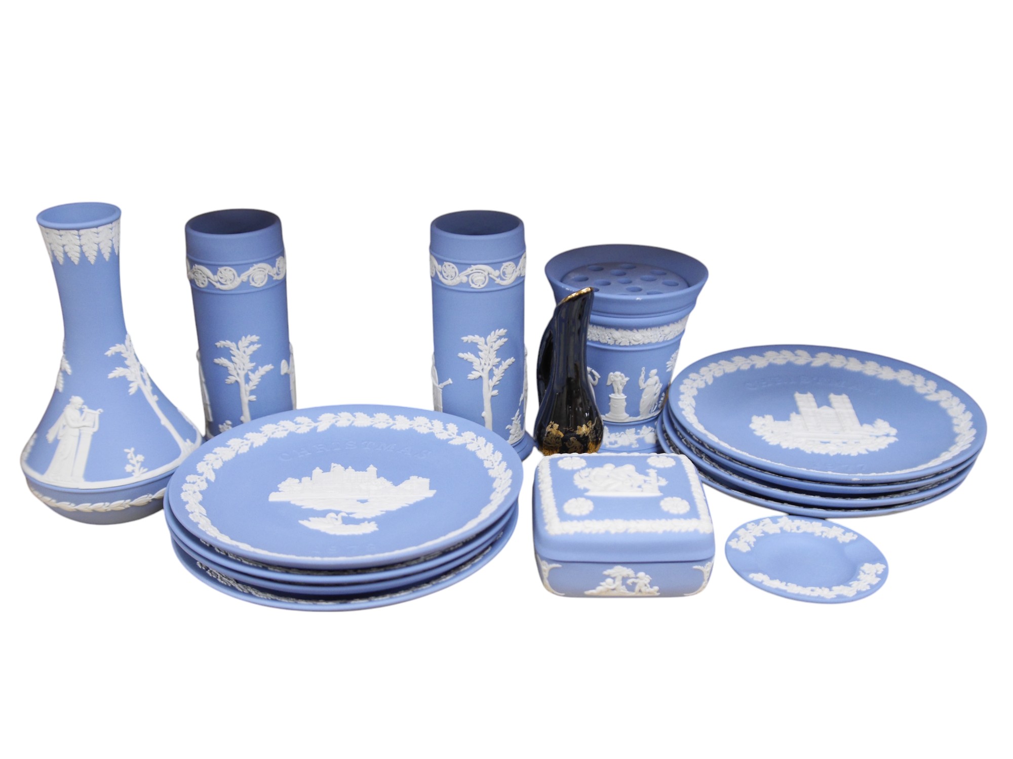 Group of Wedgwood jasper ware to include a pair of vases and a set of eight Christmas plates, largest 21cm in diameter. Condition - good